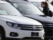 LM Otero/Associated Press
Meredith Havens looks at Volkswagens at a dealership in Richardson, Texas. Volkswagen reported its best February since 1973. The company's sales were up 3 percent. Sales of the new Beetle nearly tripled in February.