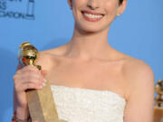 Anne Hathaway holds the award for best performance by an actress in a supporting role in a motion picture for her work in &quot;Les Miserables&quot; backstage at the 70th Annual Golden Globe Awards at the Beverly Hilton Hotel in Beverly Hills, Calif.