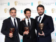 Actors George Clooney, Grant Heslov, and Ben Affleck pose with the award for Best Film, for &quot;Argo,&quot; backstage at the BAFTA Film Awards at the Royal Opera House on Sunday, in London. The film was produced by Clooney and Heslov and was directed by Affleck.