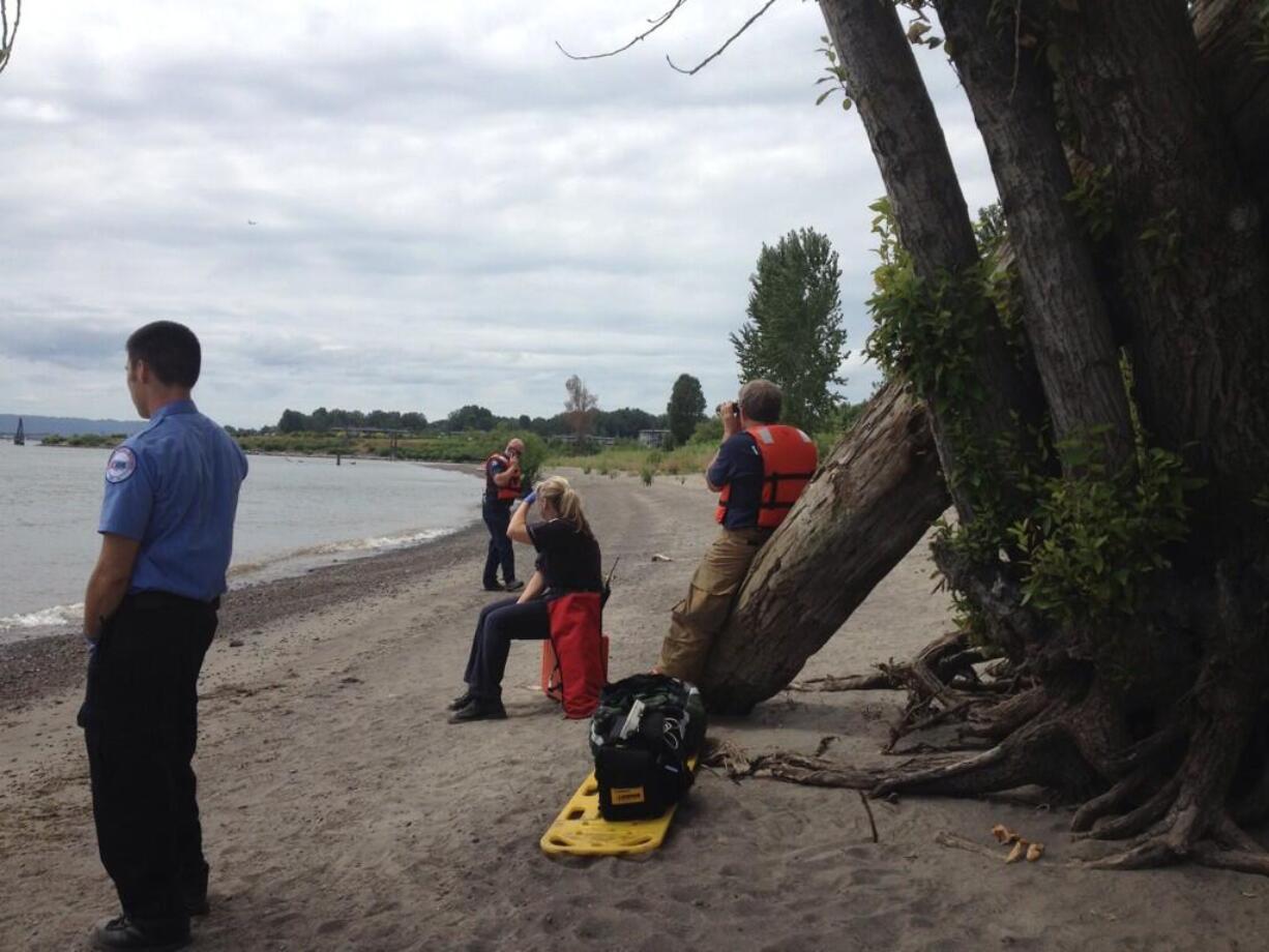 Emergency medical responders wait at Wintler Park for a patient after a swimmer was reported to possibly be in distress this afternoon.