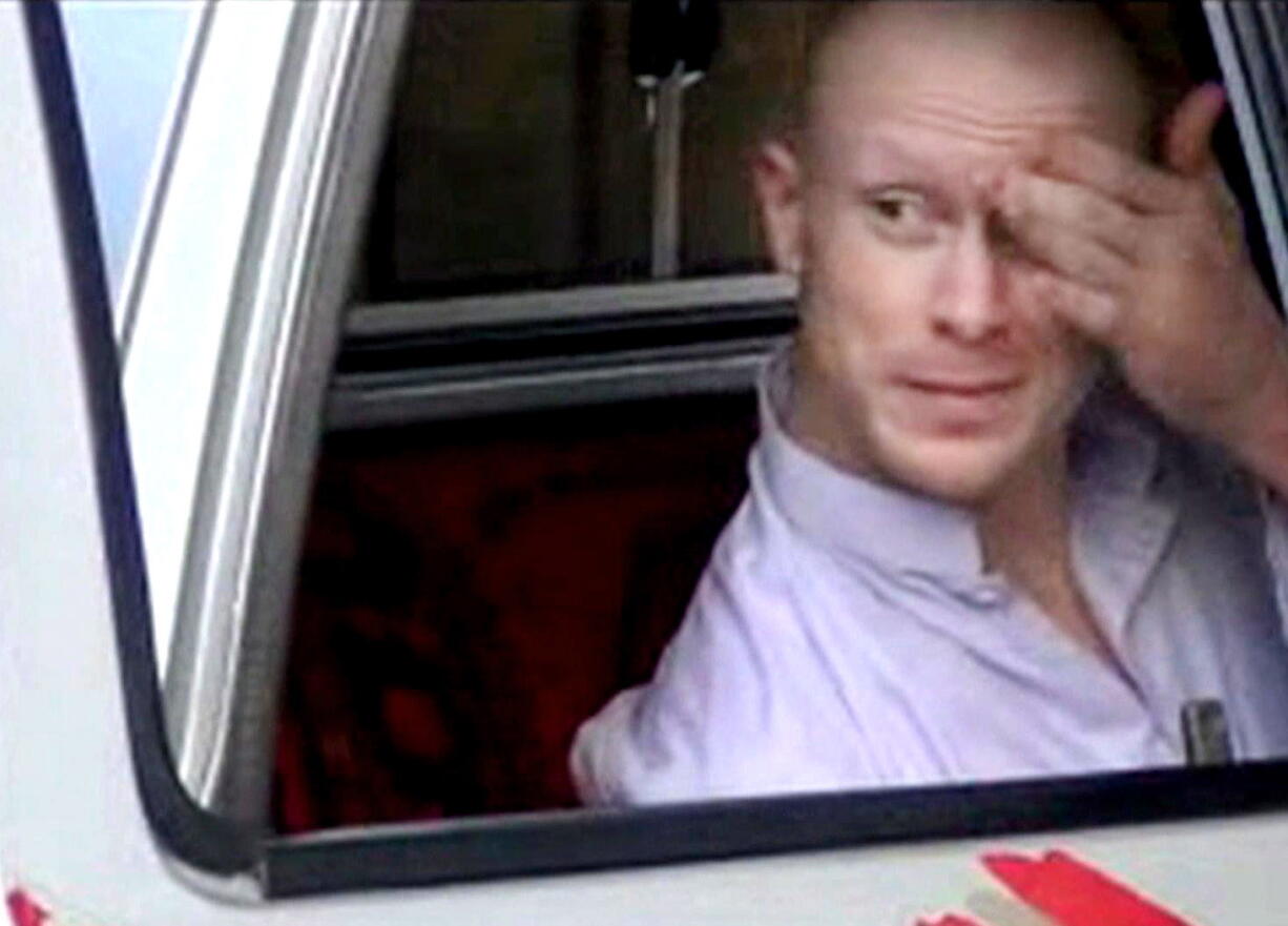 Sgt. Bowe Bergdahl, sits in a vehicle guarded by the Taliban in eastern Afghanistan.