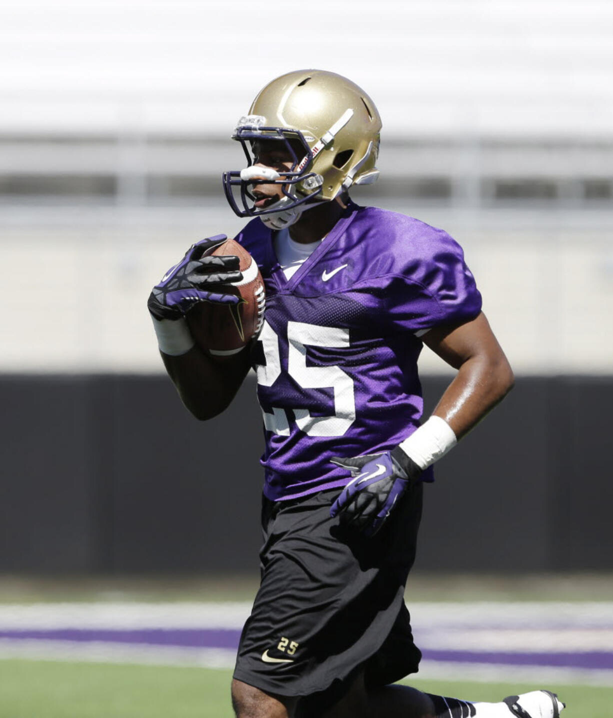 Washington's Bishop Sankey runs at the team's first football practice last week in Seattle.