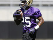 Washington's Bishop Sankey runs at the team's first football practice last week in Seattle.