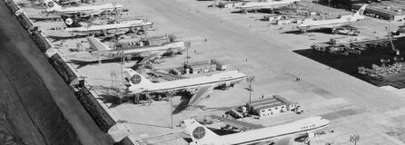 Workers are dwarfed by the immensity of Boeing 747 jumbo jet nearing completion at the company's plant at Everett.