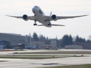 A Boeing 787 lifts off March 25 at Paine Field in Everett.