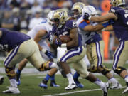 Washington's Bishop Sankey runs the ball against Boise State in the first half Saturday.