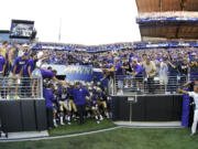 Washington head coach Steve Sarkisian prepares to lead his team out of the tunnel into newly renovated Husky Stadium on Saturday.