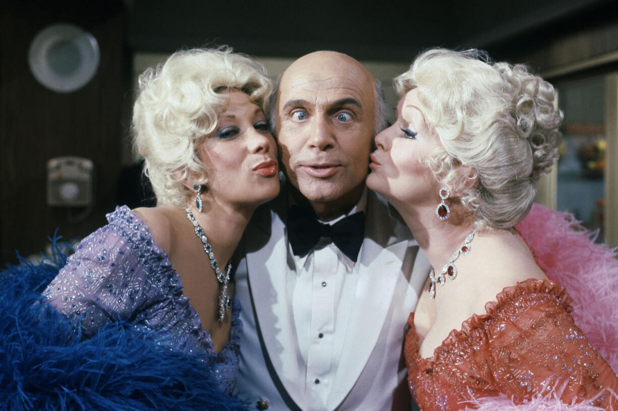 Gavin MacLeod, center, with Debbie Reynolds, right, and Marilyn Michaels as special guest stars on &quot;Love Boat&quot; in 1982.