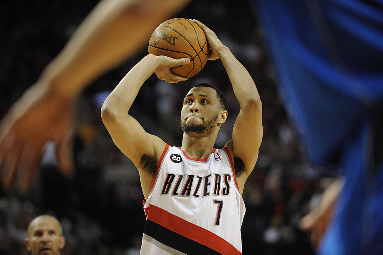 Brandon Roy, 7, of the Portland Trail Blazers shoots a free throw after getting fouled on a three point attempt during game 4 of the NBA playoffs against the Dallas Mavericks at the Rose Garden Saturday April 23, 2011 in Portland, Oregon. Portland beat Dallas 84-82.