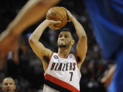 Brandon Roy, 7, of the Portland Trail Blazers shoots a free throw after getting fouled on a three point attempt during game 4 of the NBA playoffs against the Dallas Mavericks at the Rose Garden Saturday April 23, 2011 in Portland, Oregon. Portland beat Dallas 84-82.