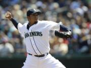 Seattle starter Felix Hernandez pitched eight innings, struck out nine and allowed four hits as the Mariners beat Milwaukee 2-0 on Sunday.