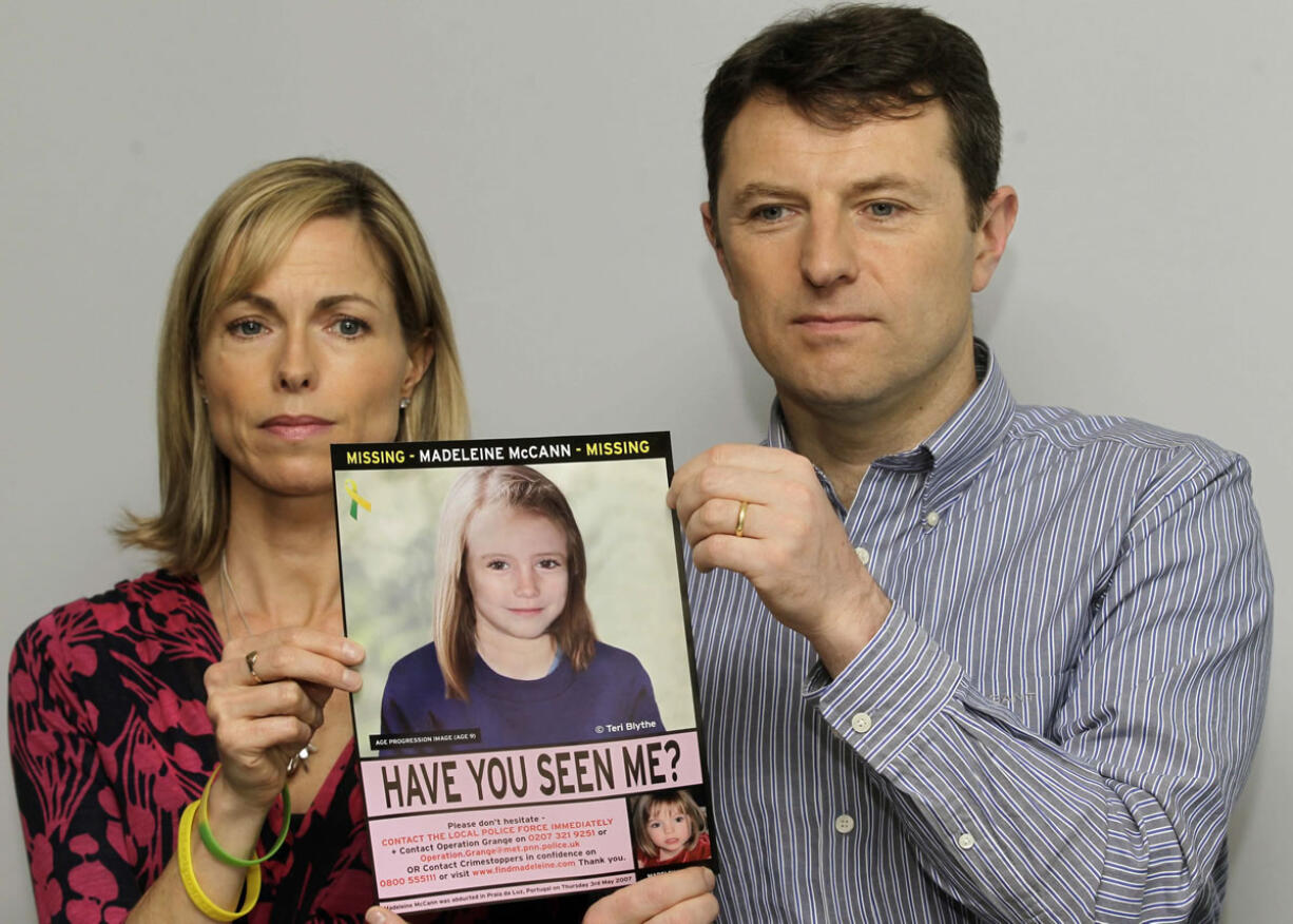 Kate and Gerry McCann pose for the media in 2012 with a poster that shows a computer-generated age-progression image of how their daughter, Madeleine, might look at 9 years of age.