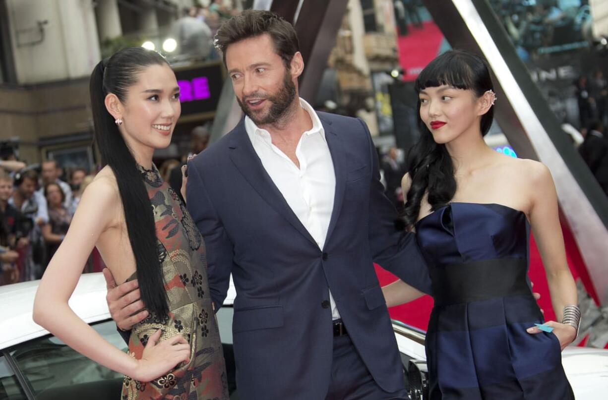 Actors, from left, Tao Okamoto, Hugh Jackman and Rila Fukushima arrive for the U.K.