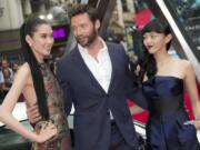 Actors, from left, Tao Okamoto, Hugh Jackman and Rila Fukushima arrive for the U.K.