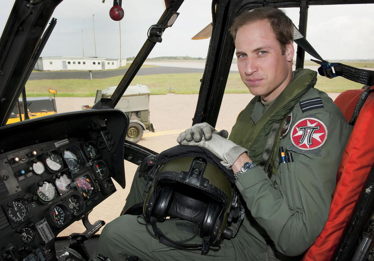 Britain's Prince William sits in the cockpit of a helicopter at RAF Valley in Anglesey, Wales, on June 1, 2012.