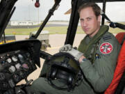 Britain's Prince William sits in the cockpit of a helicopter at RAF Valley in Anglesey, Wales, on June 1, 2012.