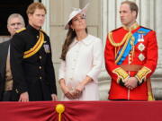 Britain's Prince Harry, left, Kate, Duchess of Cambridge, center, and Prince William, on the balcony of Buckingham Palace, on June 15 during the Trooping The Colour parade, in London.