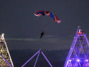 British stuntman Mark Sutton parachutes into Olympic Stadium dressed as James Bond during the Olympic Games 2012 Opening Ceremony on July 27, 2012.