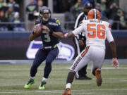 Seattle Seahawks quarterback Russell Wilson in action against the Cleveland Browns in the first half of an NFL football game, Sunday, Dec. 20, 2015, in Seattle. (AP Photo/Ted S.