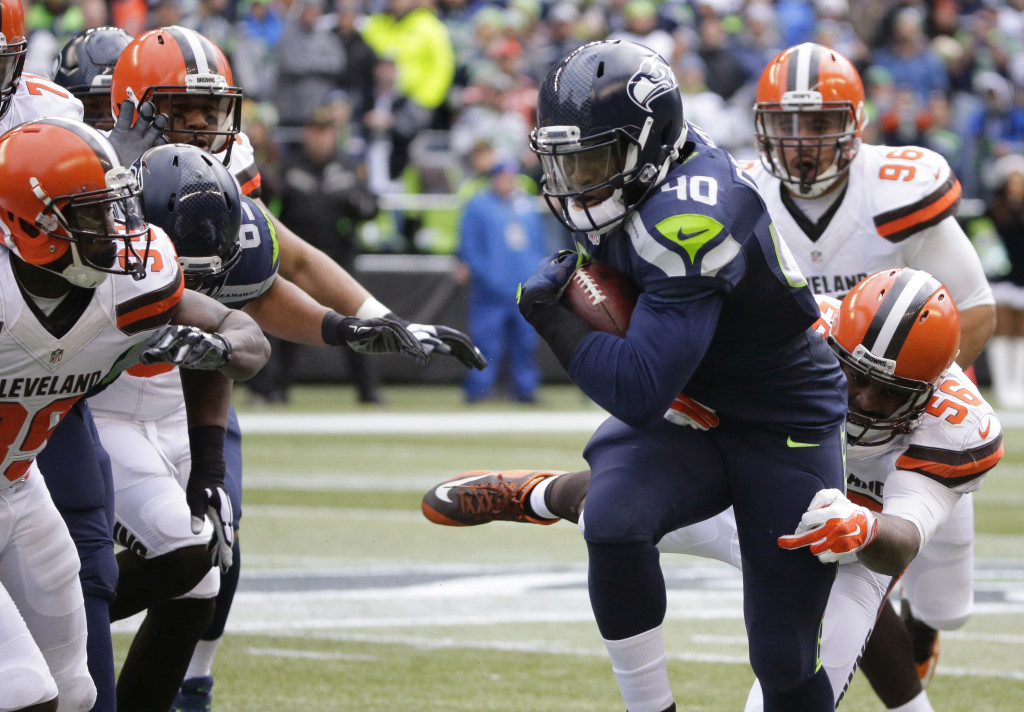 Seattle Seahawks' Derrick Coleman runs with the ball against the Cleveland Browns in the first half of an NFL football game, Sunday, Dec. 20, 2015, in Seattle. (AP Photo/Ted S.