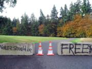 A pair of concrete barricades block the entrance to the visitors center for Olympic National Park as the government remains partially shut down in Port Angeles.