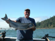 Gary Baker of Olympia with a small chinook caught upstream of the Astoria Bridge at Buoy 10.