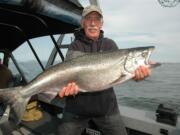 Keith Martin of Greshman with a fin-clipped chinook caught at Buoy 10.