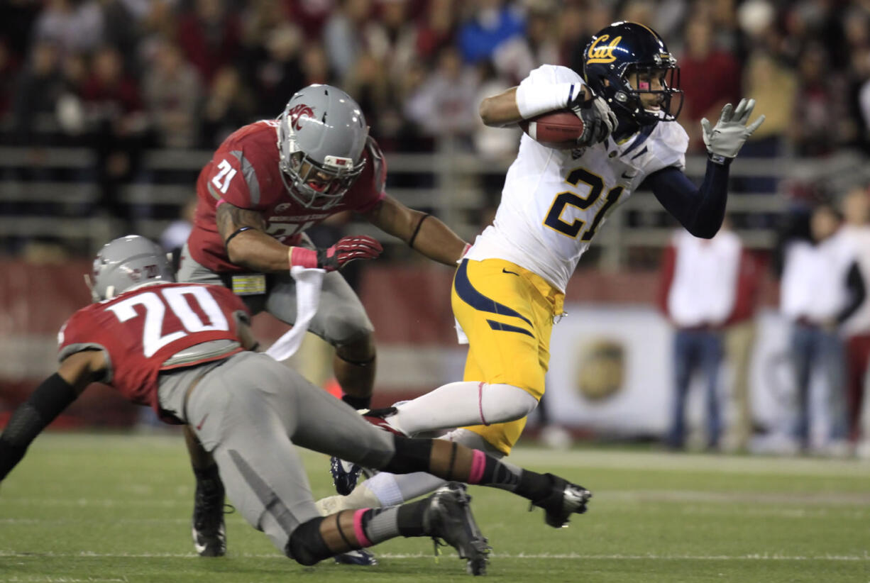 California wide receiver Keenan Allen (21) avoids the tackle attempt by Washington State safety Deone Bucannon (20) and linebacker Eric Oertel (21) as he scores scores a touchdown.