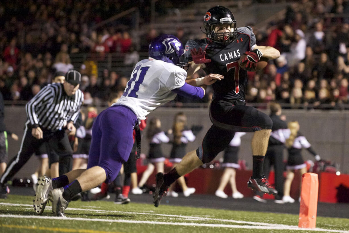 Camas running back Nate Beasley scores in the first half against Heritage at Doc Harris Stadium, Friday, October 25, 2013.