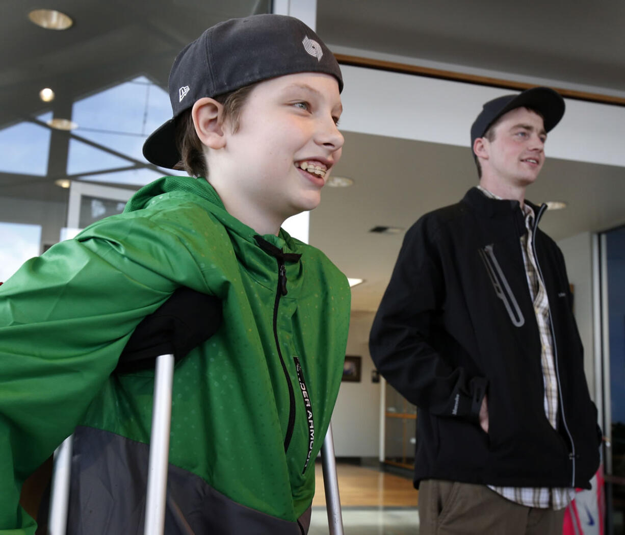 Grant Jensen, 12, and Jordan McDonald, 24, take a tour of McDonald's workplace at Mercedes-Benz of Eugene on Saturday in Eugene, Ore.