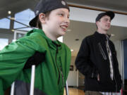 Grant Jensen, 12, and Jordan McDonald, 24, take a tour of McDonald's workplace at Mercedes-Benz of Eugene on Saturday in Eugene, Ore.