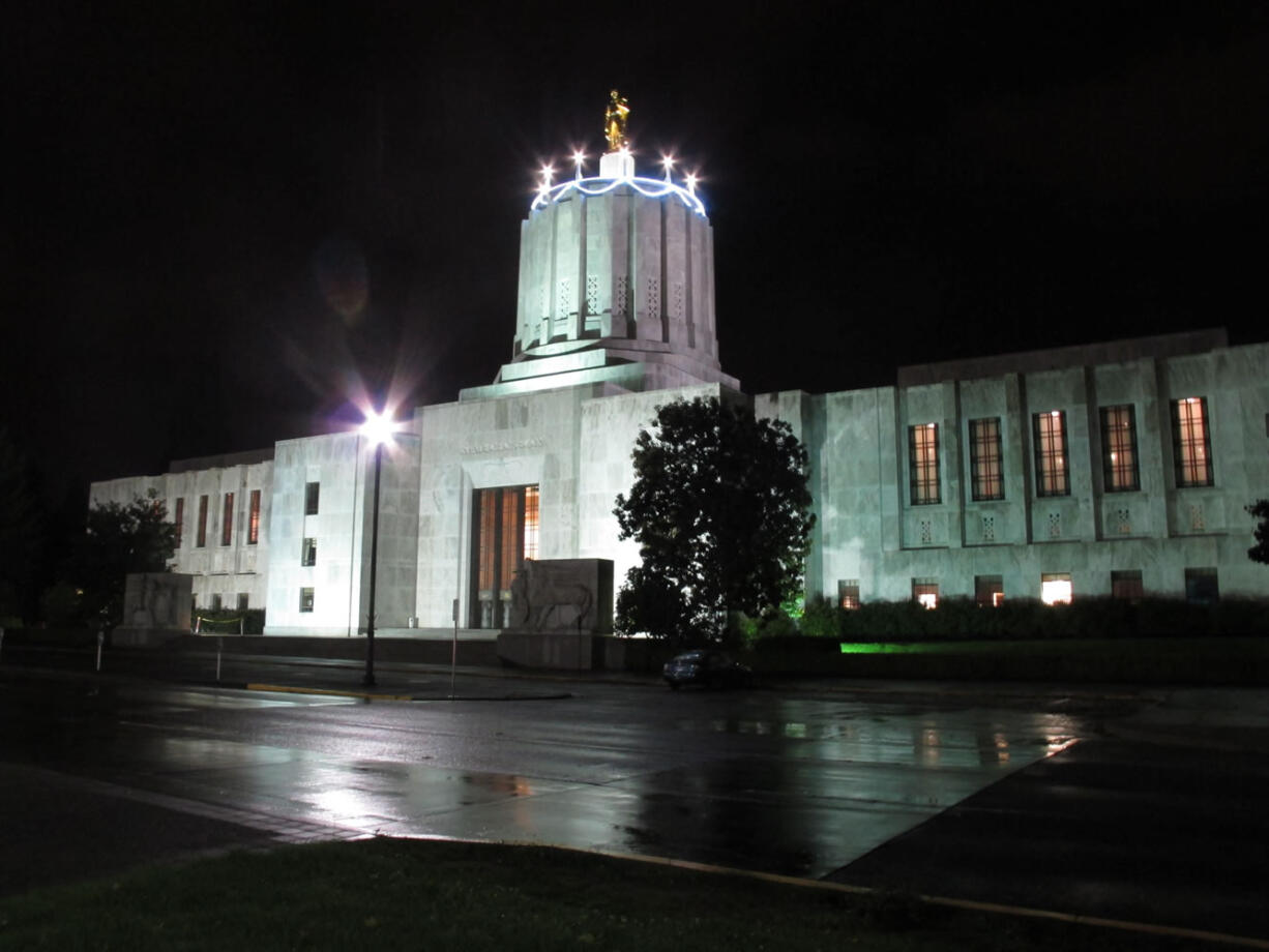 Candles are displayed atop the Oregon state Capitol in Salem on Monday, in honor of the building's 75th birthday on Oct.