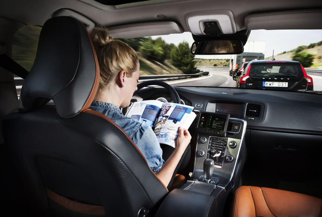 The driver of a Volvo in a road test of self-driving cars.