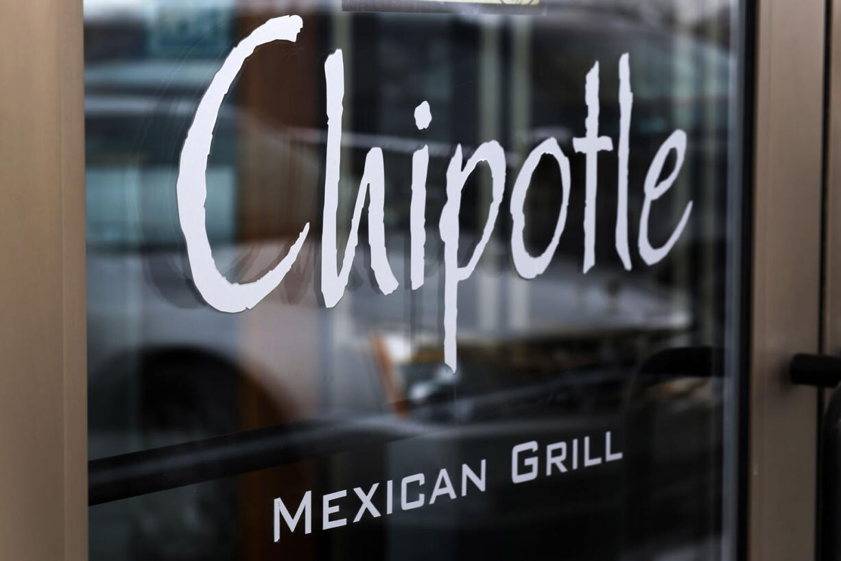 Chipotle says it is tightening its food safety standards after its restaurants were linked to dozens of cases of E. coli. The Mexican food chain says it hired IEH Laboratories in Seattle to help improve its system after reports in late October that linked E. coli cases to its restaurants in Oregon and Washington. Since then, additional cases have been reported in California, Minnesota New York, and Ohio. (AP Photo/Gene J.