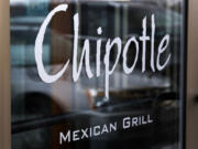 Chipotle says it is tightening its food safety standards after its restaurants were linked to dozens of cases of E. coli. The Mexican food chain says it hired IEH Laboratories in Seattle to help improve its system after reports in late October that linked E. coli cases to its restaurants in Oregon and Washington. Since then, additional cases have been reported in California, Minnesota New York, and Ohio. (AP Photo/Gene J.