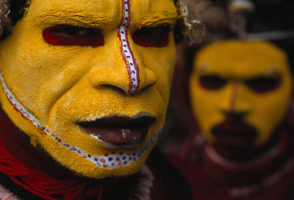 In this 1998 photo provided by National Geographic via Christieis Auction House, Huli Tribesman, in Papua New Guinea are shown. The photo is among a small selection of the National Geographic Society's most indelible photographs that will be sold at Christieis next month at an auction expected to bring about $3 million.