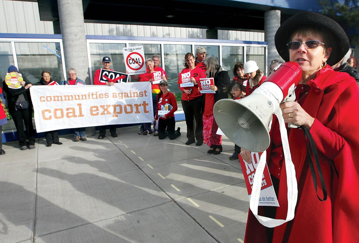 Madeleine Brown of Richland speaks Tuesday to a group of about 40 protesters in front of Trac in Pasco. They were voicing their concerns about a proposed coal export terminal in Longview.