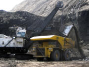 A shovel prepares to dump a load of coal into a 320-ton truck at the Black Thunder Mine in Wright, Wyo., in 2007.