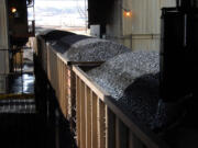 Coal passes through a loading terminal at Cloud Peak Energy's Spring Creek mine near Decker, Mont.