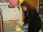 Connecticut College
Lina Hajj, a dining services staff member, assembles a birthday bash care package that parents can order online for pick-up by their kids on campus.