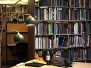 Taewon Kim, an electrical engineering systems graduate student, sleeps in the library at the Duderstandt Center on the campus of the University of Michigan, in Ann Arbor, Mich., in July.