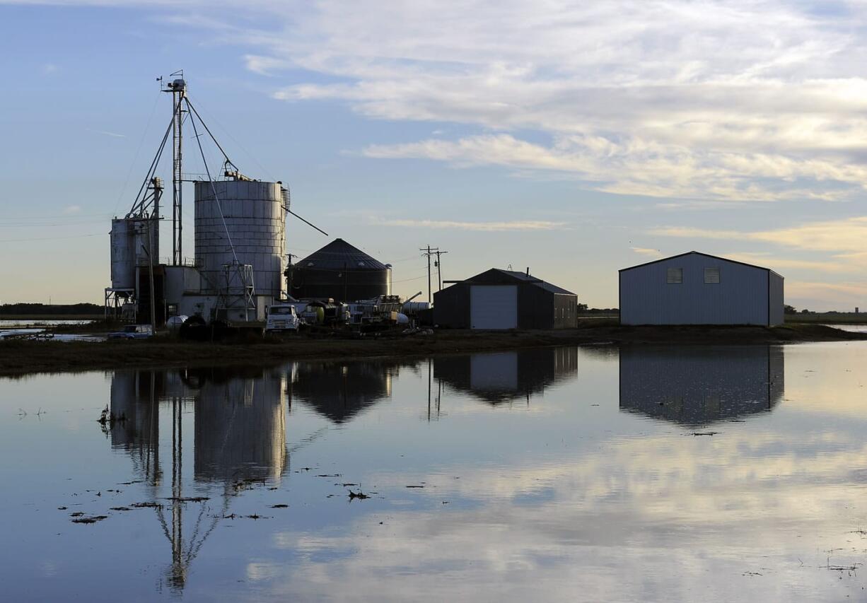 A farm is surrounded by floodwaters near Crook, Colo., on Tuesday.