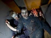 Zombies roam the haunted house at Vancouver Plaza last year.