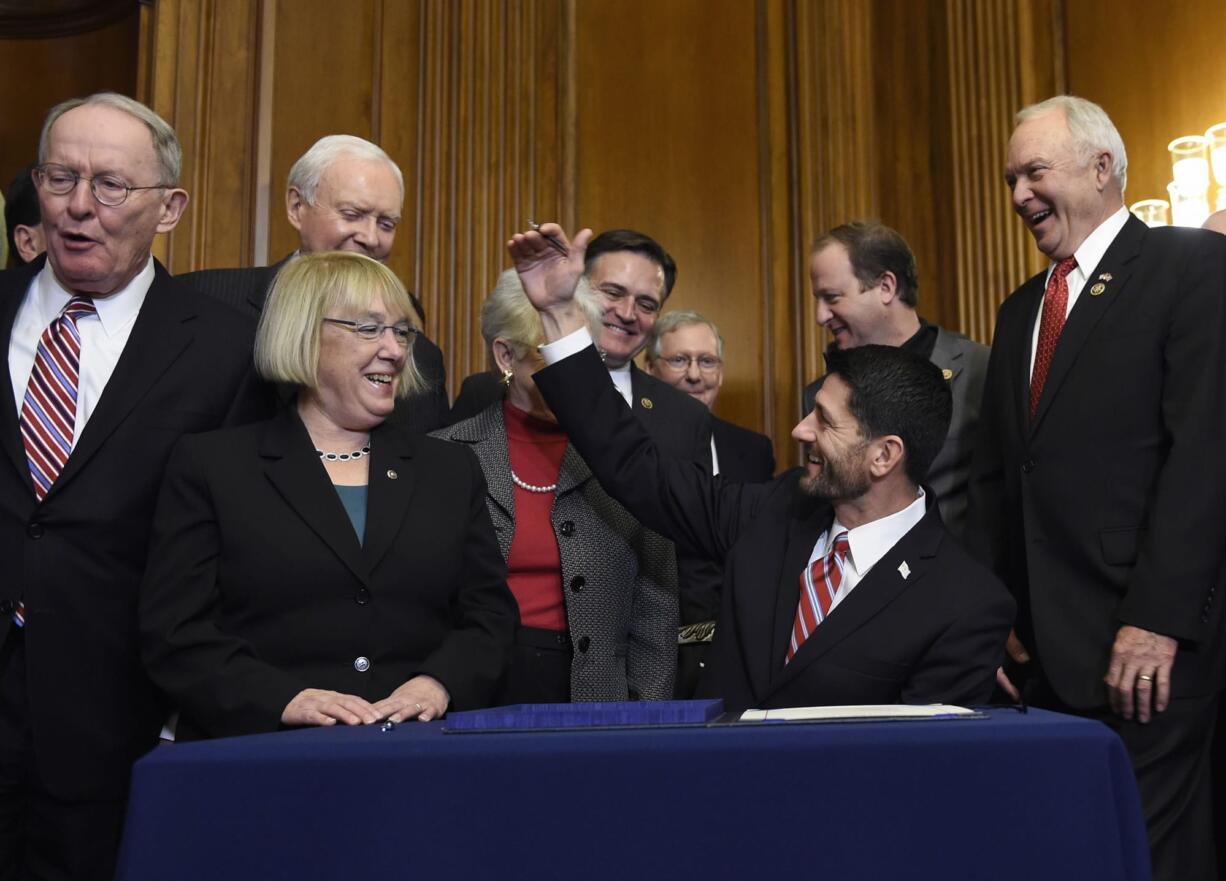 House Speaker Paul Ryan, R-Wis., sits down to sign education legislation Wednesday on Capitol Hill. From left are Senate Health, Education, Labor and Education Committee Chairman Sen. Lamar Alexander, R-Tenn., and the committee&#039;s ranking member, Sen. Patty Murray, D-Wash.