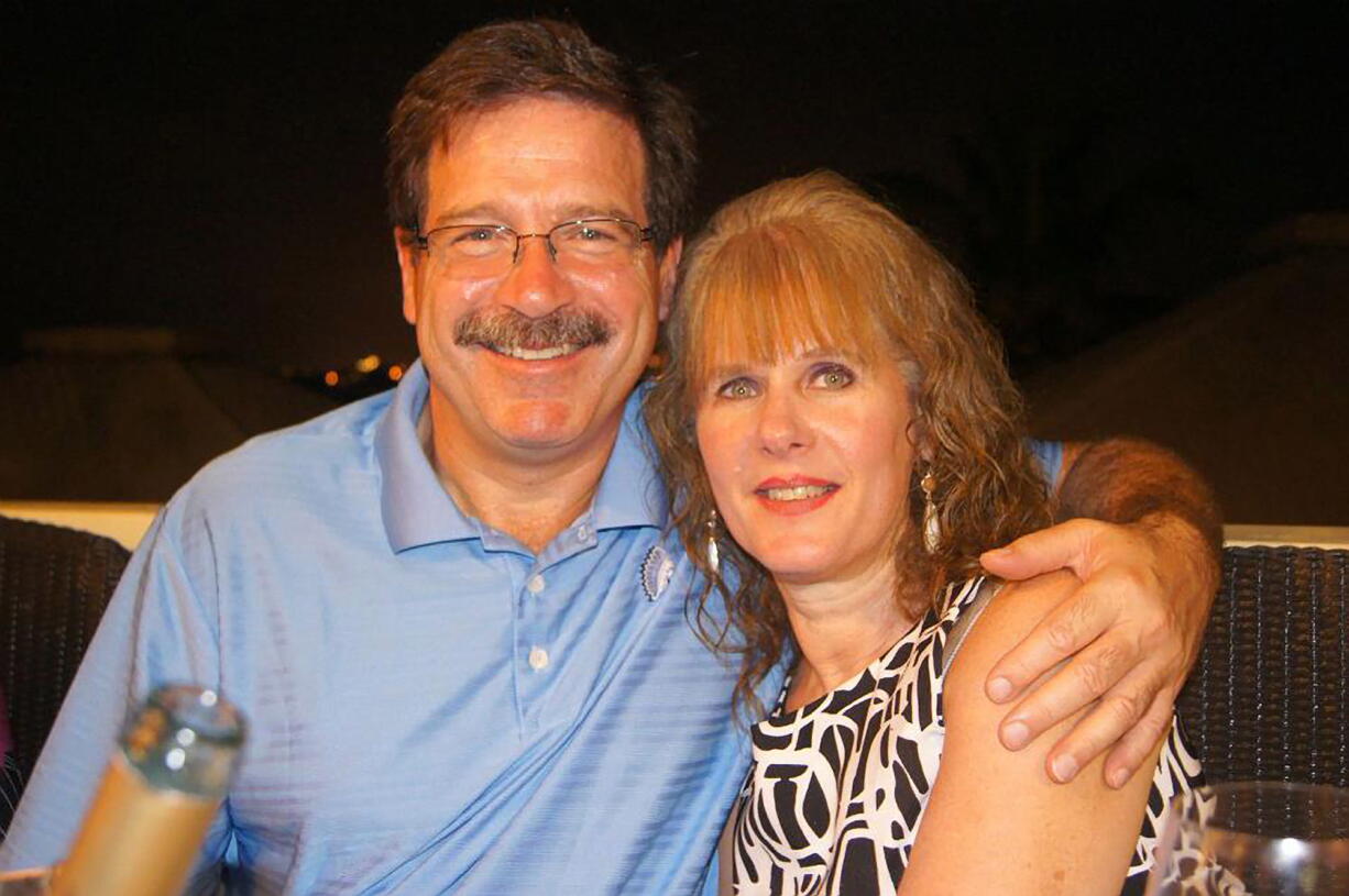 Courtesy of Mark Sherlach 
 In this undated photo provided by Mark Sherlach, Mark Sherlach and his wife, school psychologist Mary Sherlach, pose for a photo. Mary Sherlach was killed Friday when a gunman opened fire at Sandy Hook Elementary School, in Newtown, Conn., killing 26 children and adults at the school.