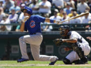 Chicago Cubs' Darwin Barney hits an RBI double in the second inning Sunday against the Seattle Mariners.