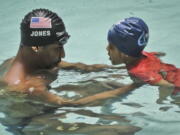 Simone Smalls PR
Olympic gold medalist Cullen Jones give swimming lessons to Niko Diop, a pre-kindergarten student at Harlem's P.S. 125 in New York.