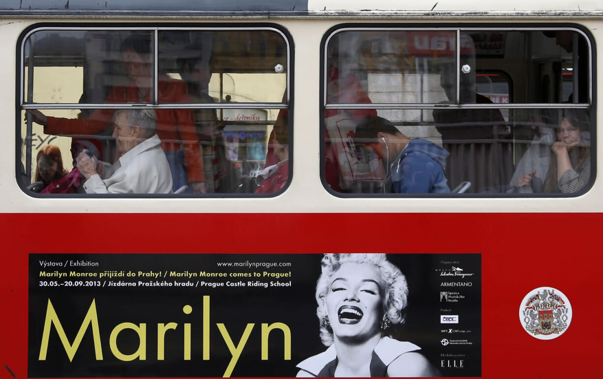 A poster advertising an upcoming Marilyn Monroe exhibition is seen on a tram in, Prague, Czech Republic, on Wednesday. Alice Titzova of the PR agency 2media organizing the exhibition at the Prague Castle said some of the photographs of the star together with mannequins and display cases for the exhibition were stolen late Monday.