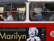 A poster advertising an upcoming Marilyn Monroe exhibition is seen on a tram in, Prague, Czech Republic, on Wednesday. Alice Titzova of the PR agency 2media organizing the exhibition at the Prague Castle said some of the photographs of the star together with mannequins and display cases for the exhibition were stolen late Monday.