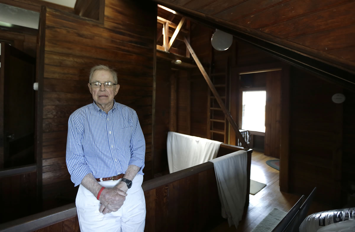 In this Friday, May 31, 2013 photo, Robert Post, 85, talks to The Associated Press about his home, in Mantoloking, N.J., which was flooded during Superstorm Sandy last year. Post has a pacemaker that needs to be checked once a month by phone, but the  phone company refuses to restore the area's landlines after they were damaged by the storm. Verizon doesnit want to replace washed-away lines and waterlogged underground cables because phone lines are outdated, it says. Meanwhile, the company is offering a wireless device that can be plugged into home phones for service, but the system does not work with pacemakers or fax machines.